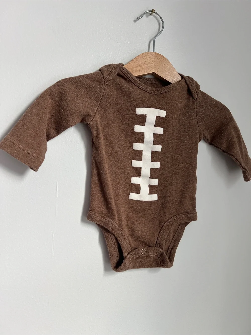 Carter’s | Brown Football-Stitch Long-Sleeve Baby One-Piece Size 3 Months
